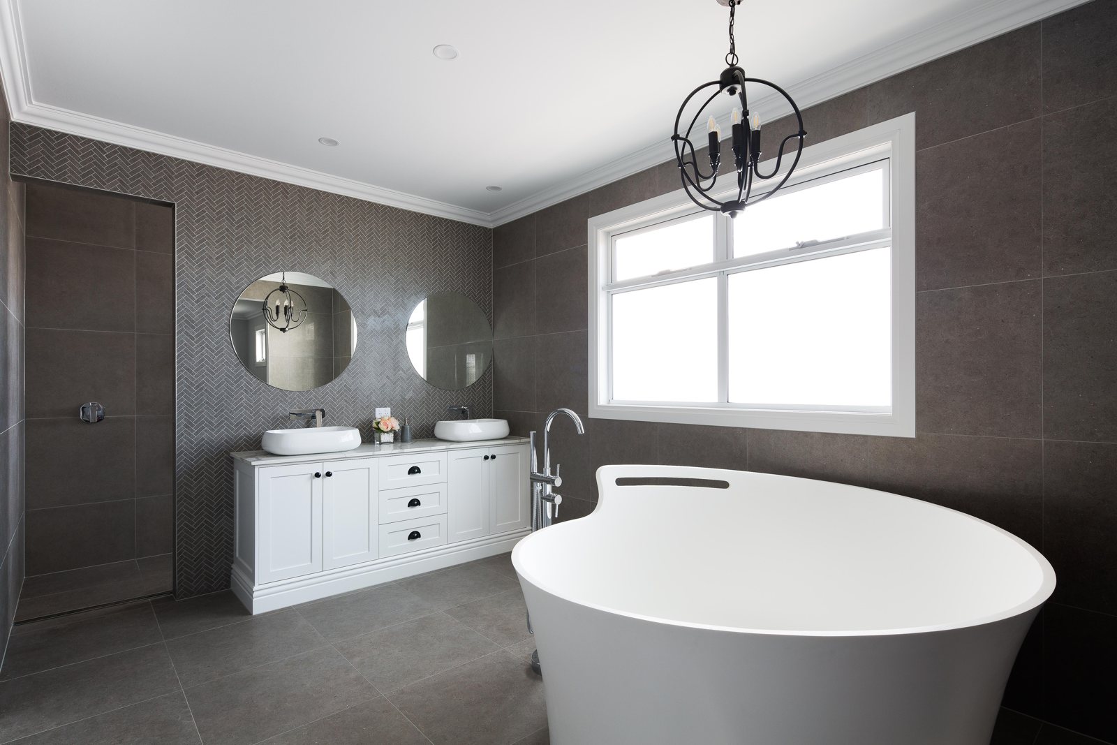 Bathroom with freestanding bath, herringbone tiled wall and twin basins, Civic Parade, Altona