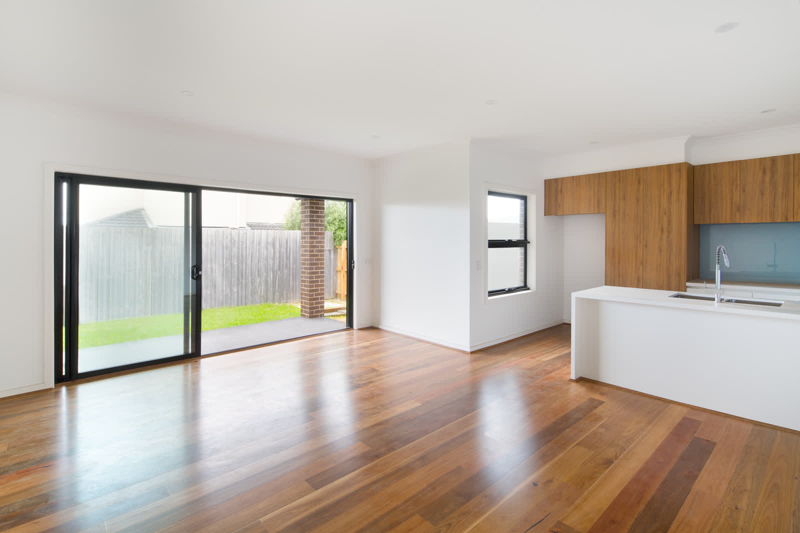 Living area with full-height glazing, Edinburgh Street, Clayton